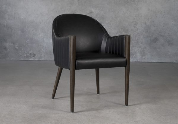 Raymond Dining Chair in Black CU Vinyl with Nutmeg Legs, Angle Raymond Dining Chair in Black CU Vinyl with Nutmeg Legs, Angle