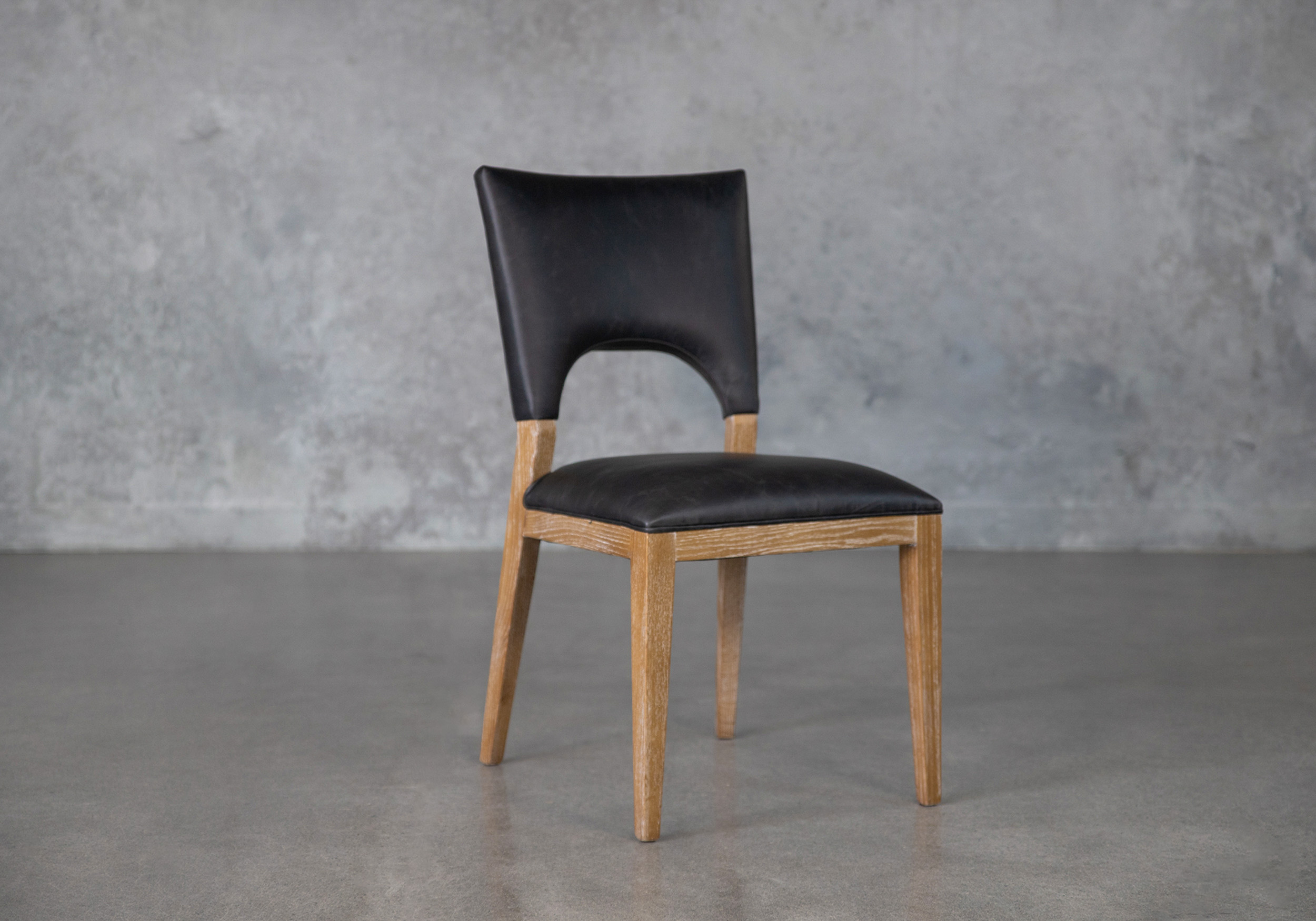 benty black leather dining chair angle